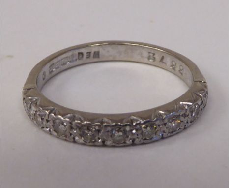 An 18ct white gold and diamond set half-eternity ring 