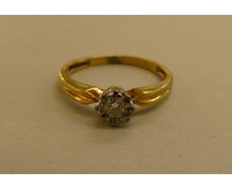 An 18ct gold claw set diamond solitaire ring 