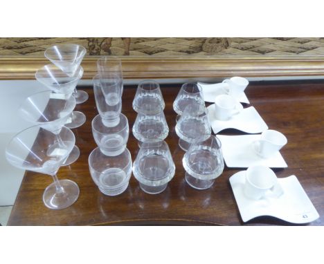 A set of four Villeroy &amp; Boch porcelain coffee mugs and saucers; and four Villeroy &amp; Boch clear glass Martini glasses