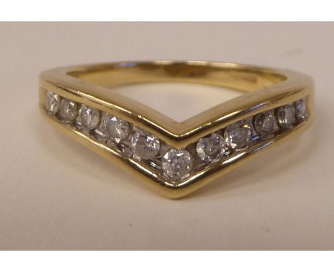 A 9ct gold diamond set wishbone design ring 