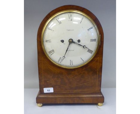 A George III round arch cased and string inlaid bracket clock with gilt metal flank lion mask and ring handles, over scale fr