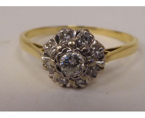 A bi-coloured gold diamond cluster ring 
