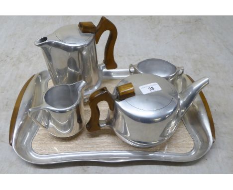 A five piece Picquot Ware tea set, comprising a tray&nbsp; 17"w, teapot, coffee pot, cream jug and a sugar basin 