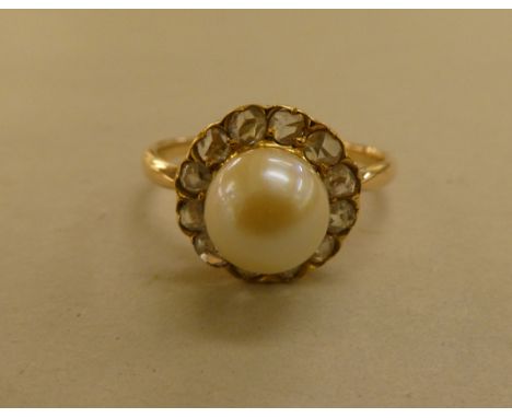 A yellow metal pearl and diamond set cluster ring 