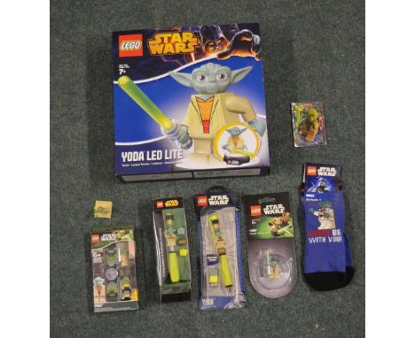Star Wars Yoda related items including lego, large boxed Yoda LED light, Yoda watch, pens, pair of socks, small figures 