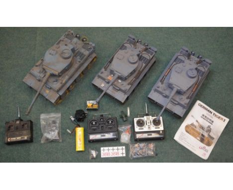 Three Tiger One radio control model tanks, two by Henglong,1:16 scale with accessories and functioning electrics, the other u