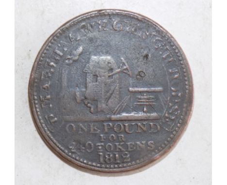 An apparent Cornish 1812 token but which has been over or under struck on another coin or token leaving a face about the engi