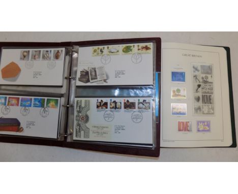 An album of first day covers and a special G.B. lighthouse album containing some used commemoratives.