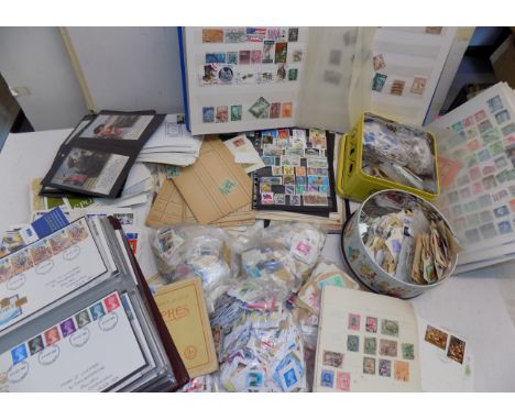 Miscellaneous stamps, first day covers, albums and bags of loose all contained in a large box.