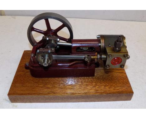 A Stuart Turner no 10H horizontal engine on wood plinth, free running.