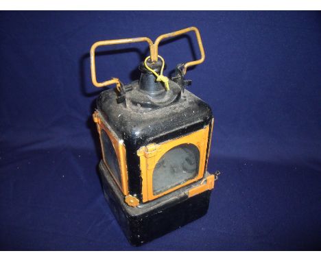 Railway lamp interior painted in black and orange stamped 55/4 