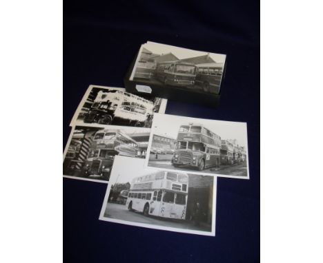 Box containing a selection of black & white photographs and photographic prints of various buses 