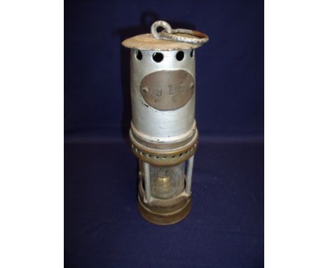 Brass and alloy miners lamp with plaque No 915 (converted to electric lamp)