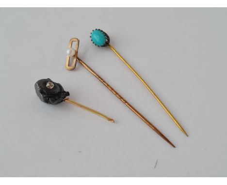 Three stick pins