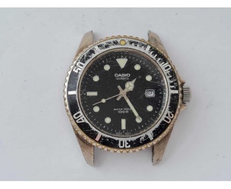 A gents wrist watch by Casio 100 M with seconds sweep and date aperture 
