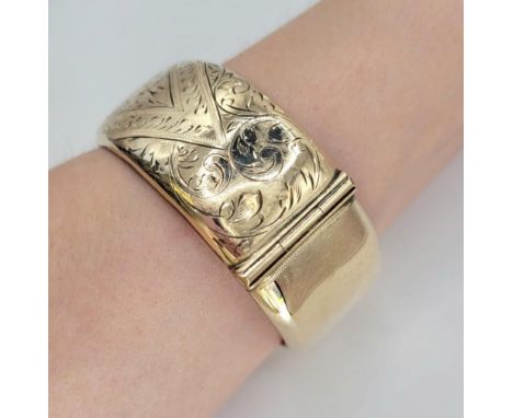 9ct gold metal core bangle , 38.7g