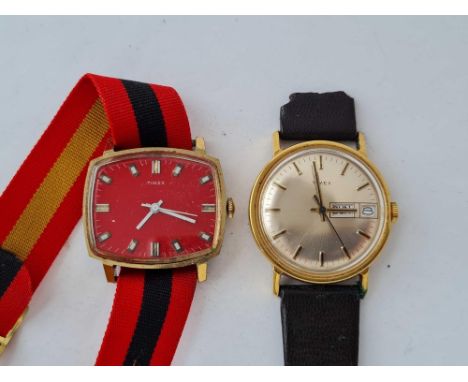 Two gents Timex wrist watches one with red dial and seconds sweep and the other with seconds sweep and date aperture W/O 