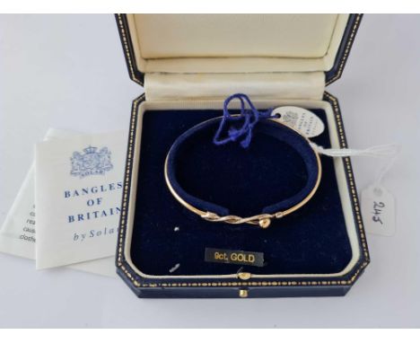 A yellow and white gold Celtic bangle 9ct 