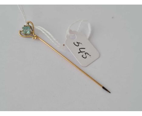A gold and aquamarine stick pin 1g inc