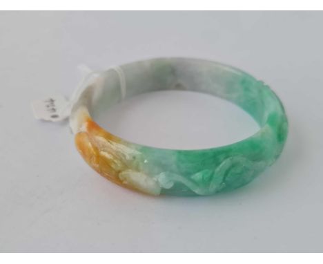 Green &amp; white carved hardstone bangle, interior diameter 62mm 