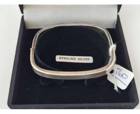 A boxed silver bracelet/bangle