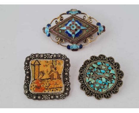 Three enamel decorated brooches 