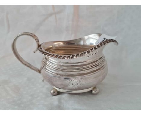 George III Newcastle silver cream jug on 4 ball feet. . 1826 by D R 151gms