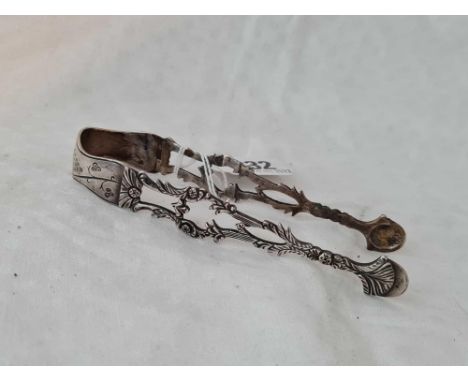 Pair of George III cast sugar tongs, decorated with flower heads by R J?