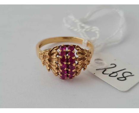 A ruby cluster ring in 18ct gold size K 3.6g inc