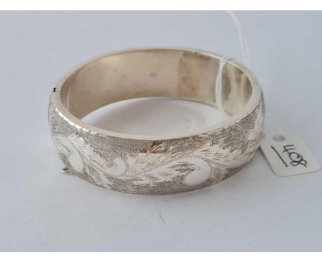 A good wide silver engraved bangle 