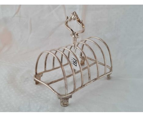 William IV 7 bar toast rack decorated with scrolls on bracket feet. 6 Inch wide. Birmingham 1833 by R F A