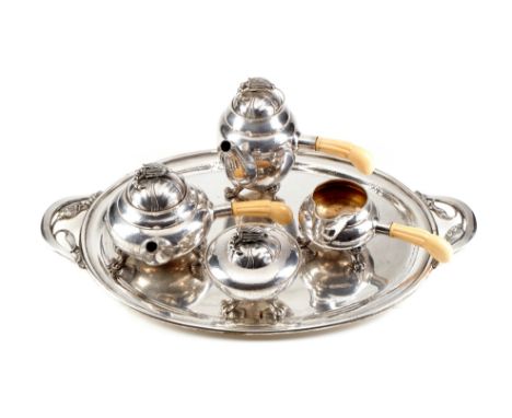 An early 20th century Italian silver coloured four piece tea service and matching tray, .800 standard, comprosing chocolate p