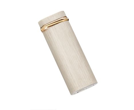 Must de Cartier, a brushed metal lighter, no. 546281, the cap with a gold plated trinity band, accompanied by a Must de Carti