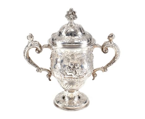 An early George III silver twin handled pedestal cup and cover by Thomas Whipham & Charles Wright, london 1760, with a foliat