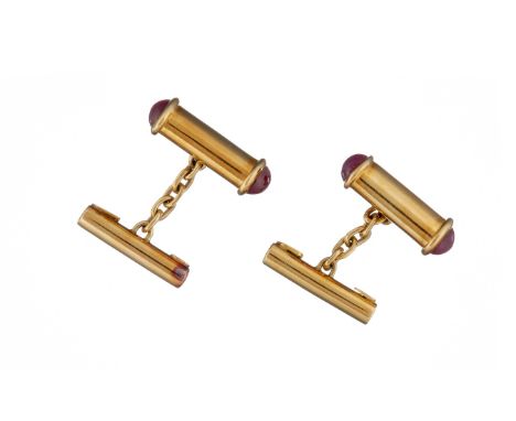 A pair of ruby cufflinks, the oval tubular fronts with cabochon ruby terminals, with chain link connections to plain tubular 