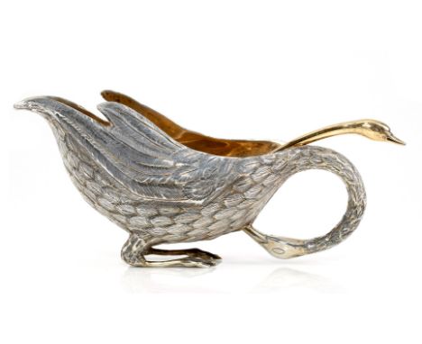 A silver coloured swan shaped sauce boat, stamped with the French swan import mark, 23cm (9in) long; together with a French s