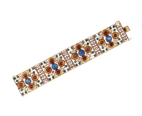 A 1960s Italian ruby and sapphire bracelet, the four panels set set with clusters of cabochon rubies and sapphires, with squa