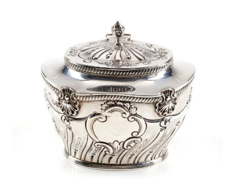 An Edwardian silver oval tea caddy by William Hutton & Sons Ltd., London 1902, with a bud finial to the domed cover, the half