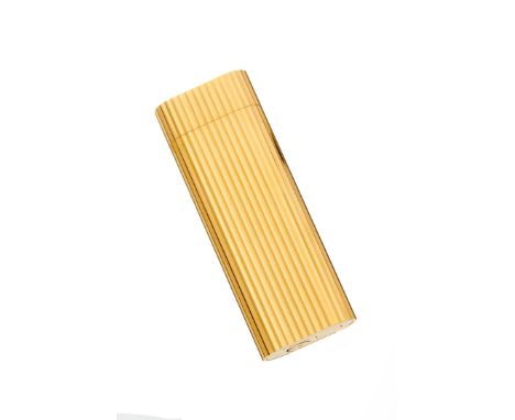 Cartier, a gold plated lighter, the reeded lighter with concealed cap, signed Cartier and numbered 42496E, 7cm long, in a red