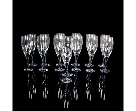 Eight beautifully crafted wine glasses with cobalt blue interior within the stem. Orrefors Sweden etched mark. One glass is s