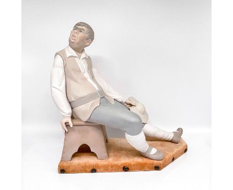Modeled as a seated Sancho Panza. Large porcelain figure, matte finish, with Lladro backstamp. This item has a base included.
