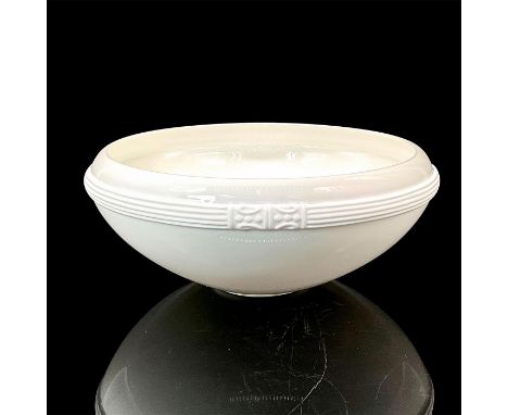 Glazed bone china with bisque 'Bangles' design on the outer side.Katy Briscoe backstamp. This item has its original box. Issu