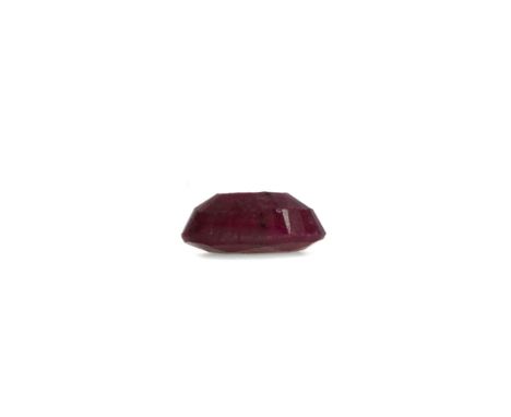 **CERTIFICATED UNMOUNTED RUBY, oval mixed cut, weighing approximately 13.80 carats, with accompanying report from the Gemolog