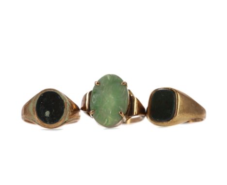 TWO BLOODSTONE AGATE RINGS, each set with an oval bloodstone, one in nine carat gold, the other in fifteen carat gold, along 