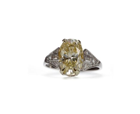 GIA CERTIFICATED YELLOW DIAMOND RING, the oval diamond of approximately 3.02 carats with accompanying report number 515133011