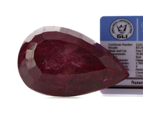 **CERTIFICATED UNMOUNTED RUBY, pear mixed cut, weighing approximately 833 carats, with evidence of colour enhancement, with a