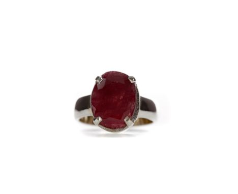 **CERTIFICATED UNMOUNTED RUBY, oval mixed cut, weighing approximately 10.74 carats, glass filled, with report from GJSPC Indi