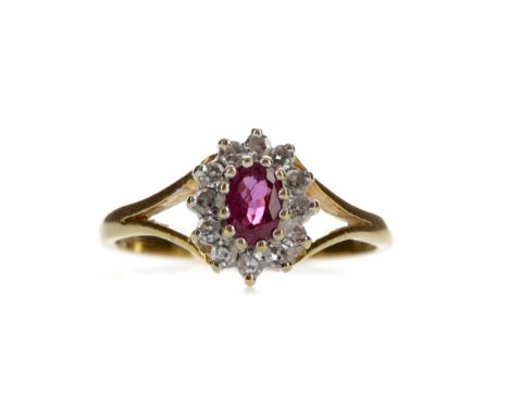 RUBY AND DIAMOND CLUSTER RING, set with an oval ruby within a halo of round brilliant cut diamonds totalling approximately 0.