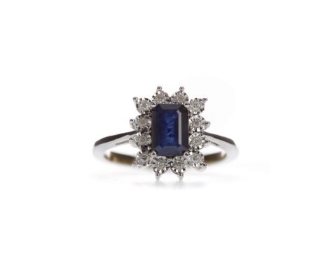 SAPPHIRE AND DIAMOND CLUSTER RING, set with an octagonal step cut sapphire within a halo of illusion set diamonds, the diamon