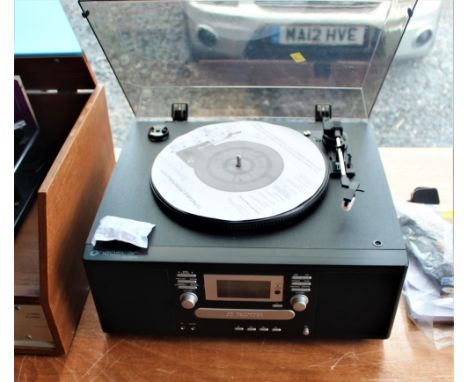 A Vinyl to Cd recorder with accessories and manual  - made by Neostar Electronics